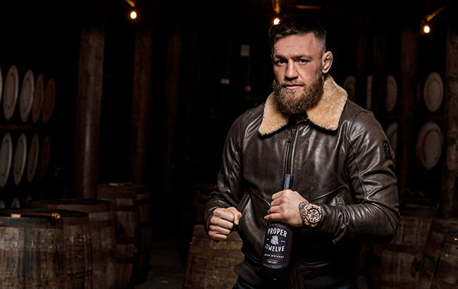 Conor McGregor holding Proper No.12 Irish whiskey