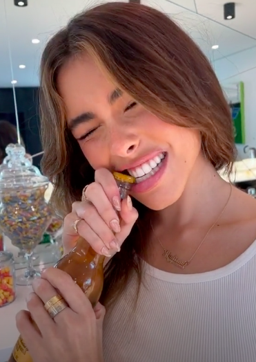 Madison Beer: opening a bottle of beer with your teeth