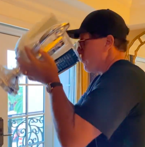 Phil Mickelson swigs from trophy