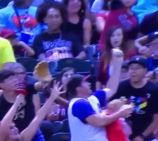 Man catches foul ball while holding baby and beer