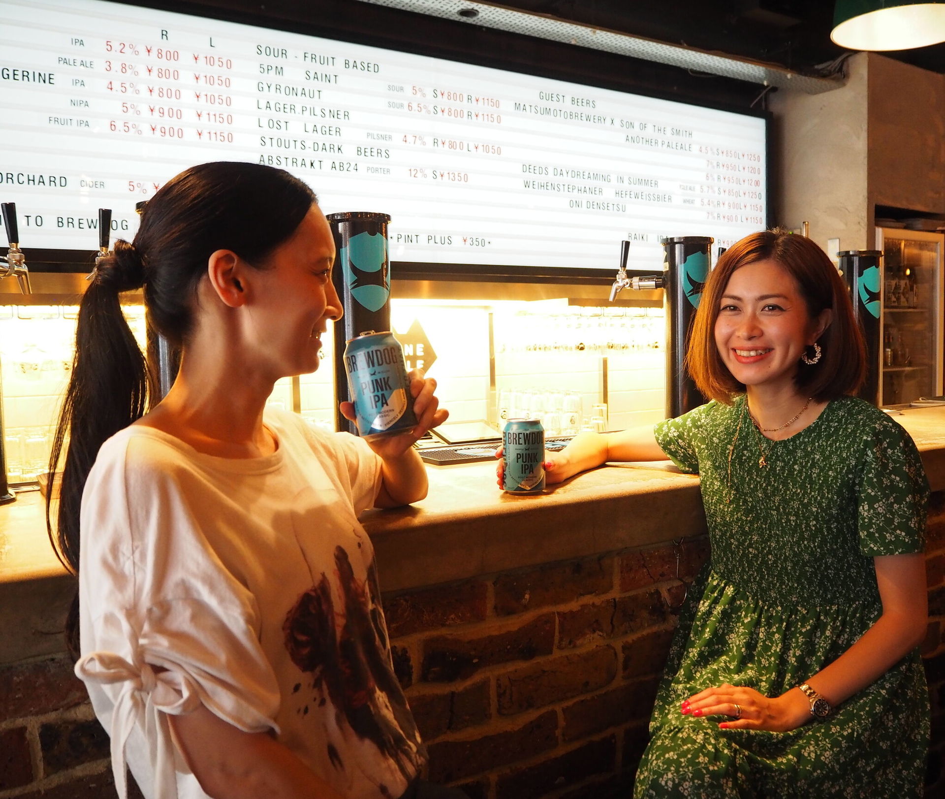 Two Japanese women enjoying a brewdog beer: BrewDog launches Japanese venture with the help of Asahi Japan