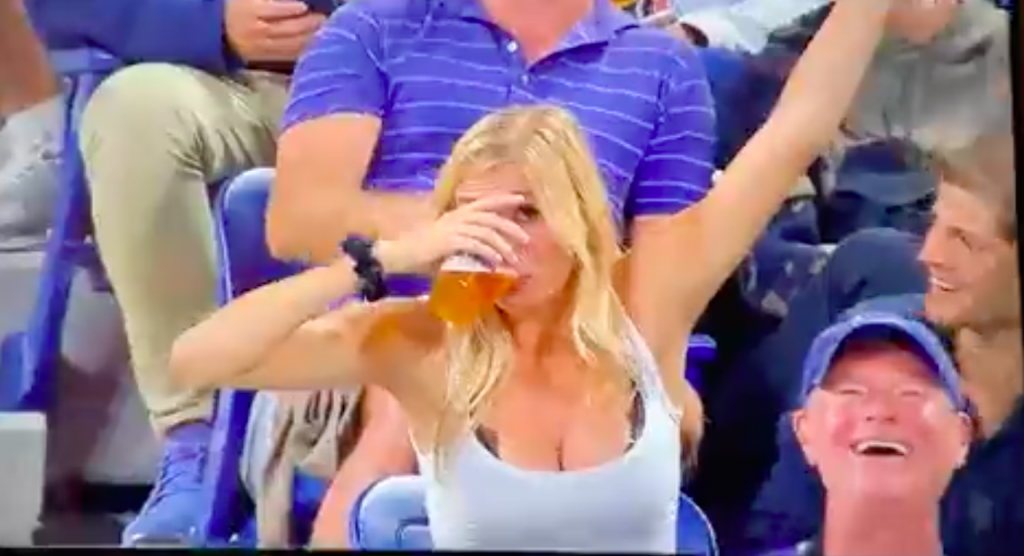 Woman chugging beer at US Open