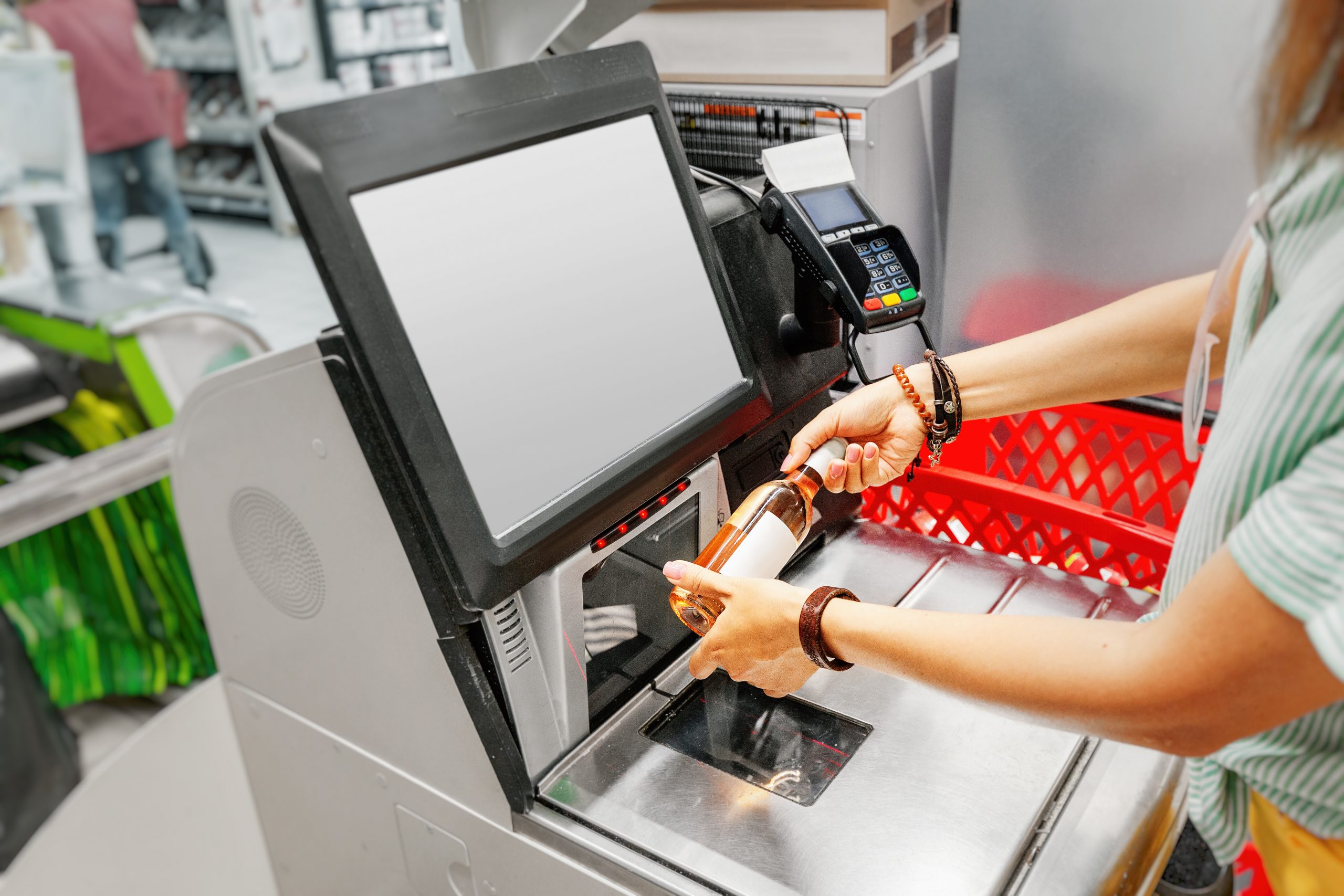 Girl scanning wine into self service checkout: Supermarkets employ AI technology to police underage alcohol sales