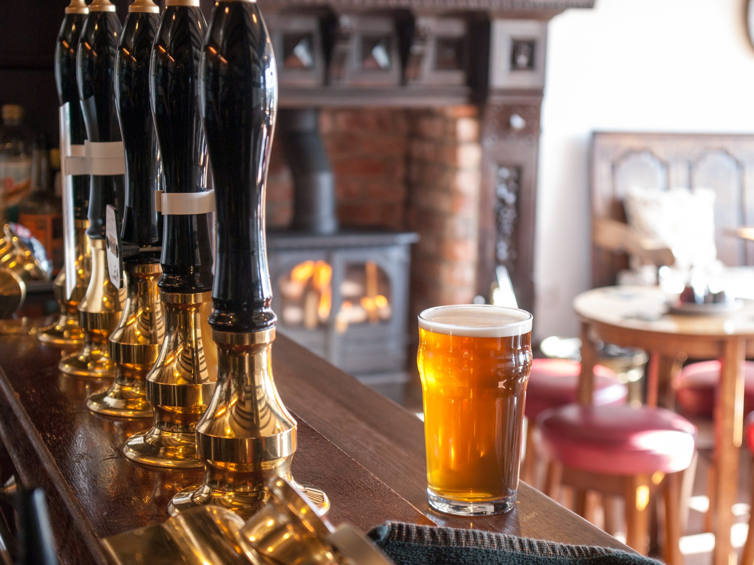 A view from behind an typical English pub bar: cask ale sales down by 76 million pints since pubs reopened