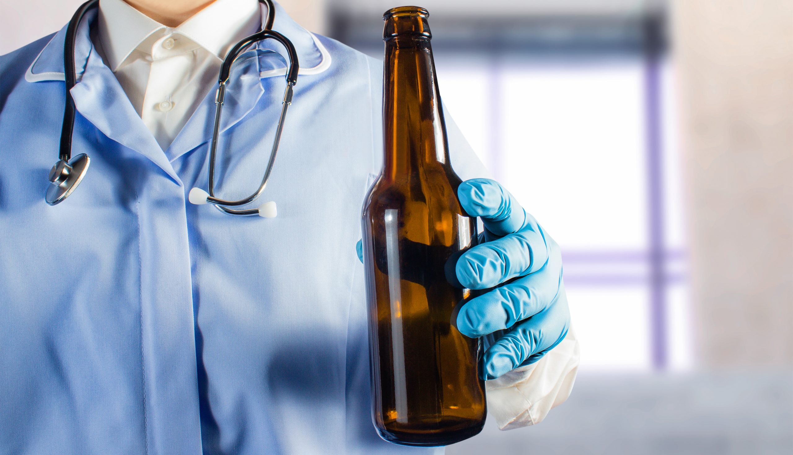 doctor holding bottle of beer: can beer make intensive care patients get home quicker?