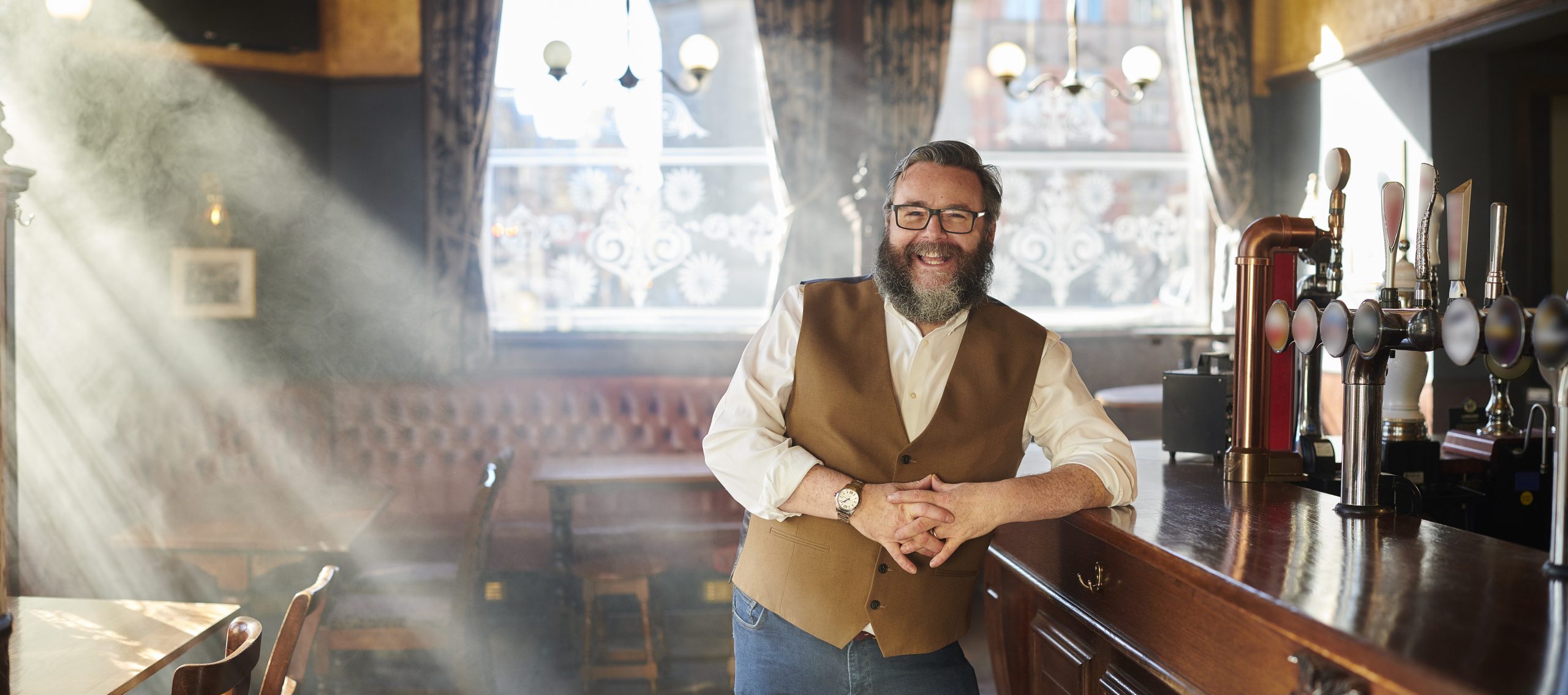 Pub landlord smiling: Greene King launches scheme to help landlords 