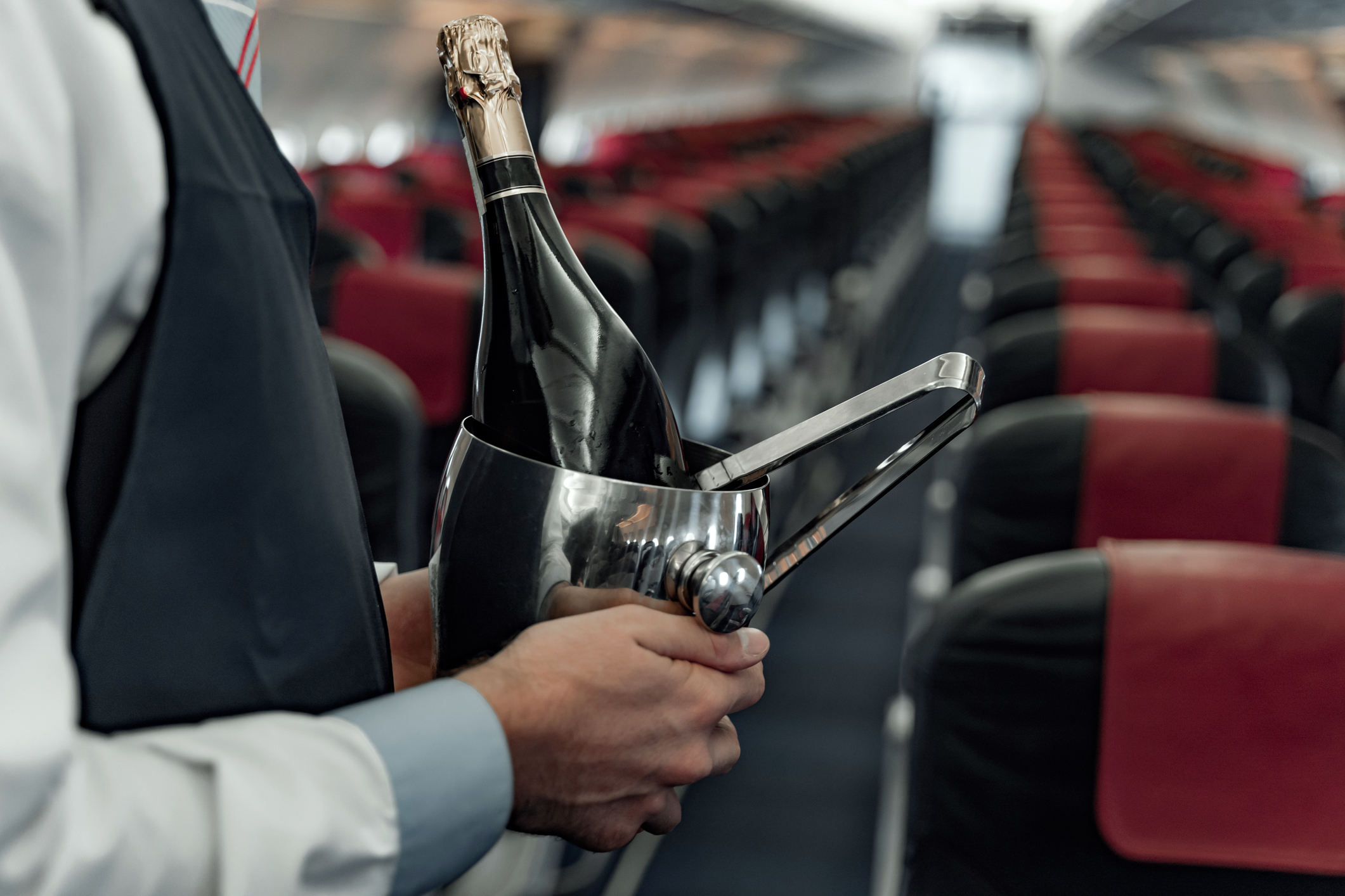 British Airways looks to hire Master of Wine - a stewardess holding Champagne