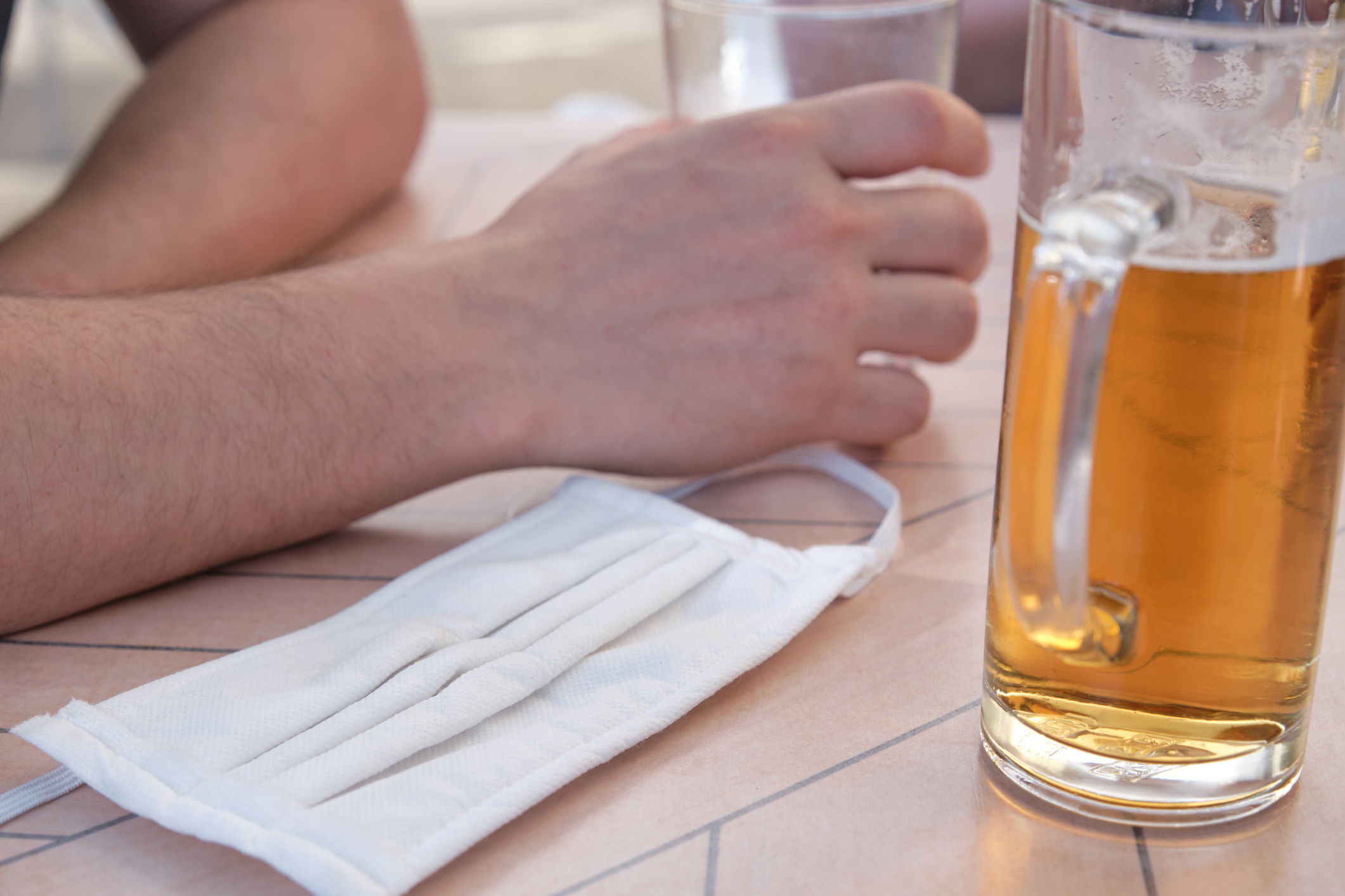 Norway alcohol ban Omicron: beer and surgical mask on table