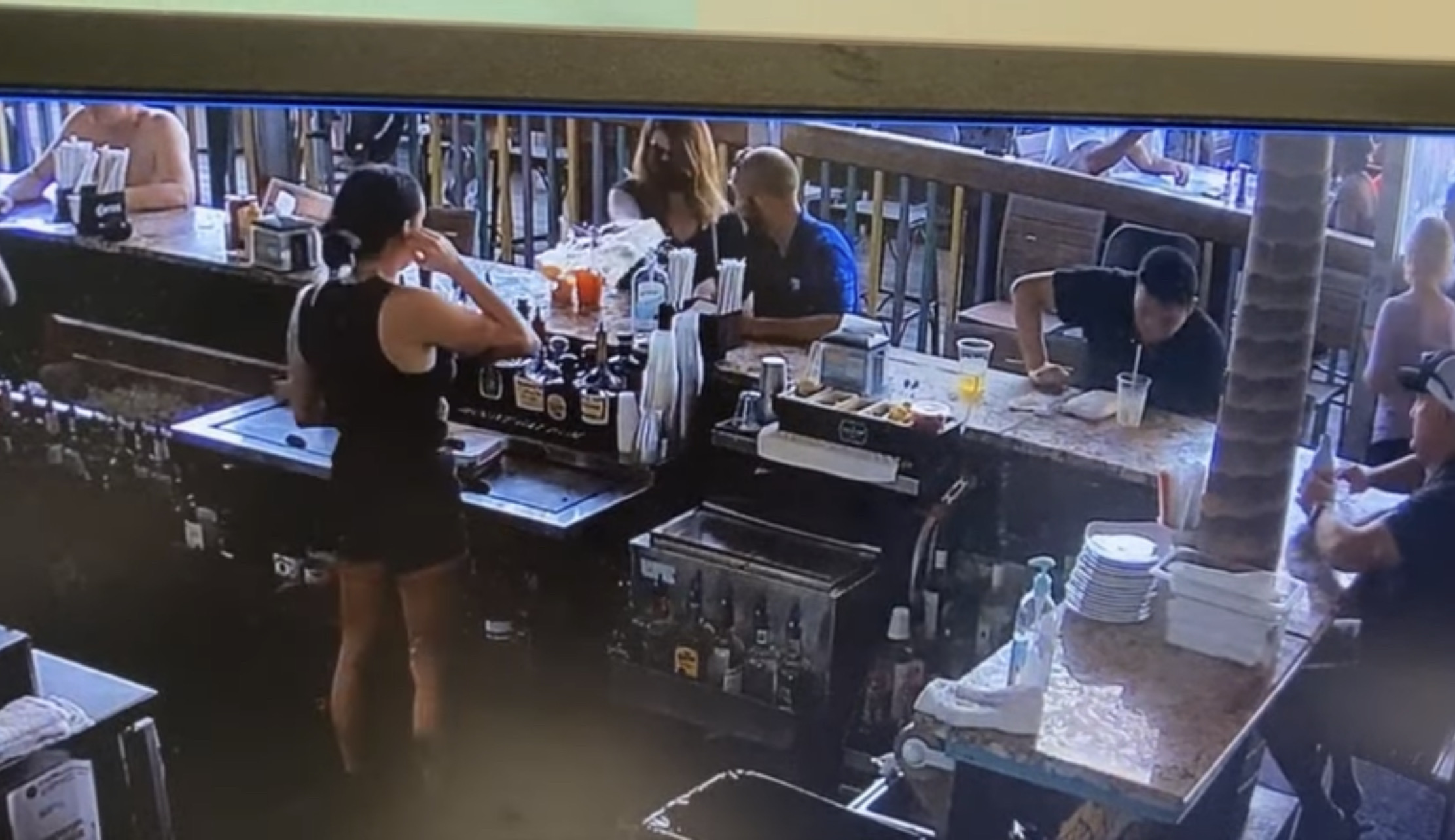 Customer throws drink at bartender 