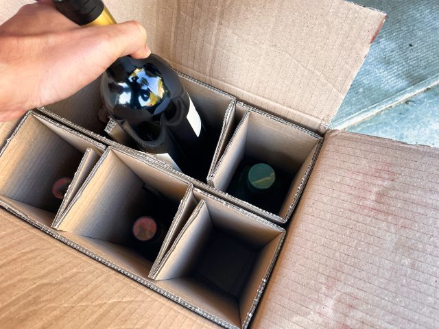 Naked Wines finances - bottles of wine in a box