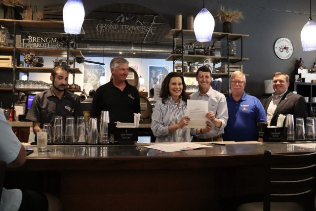 Michigan governor signs bill slashing mark up for local distillers