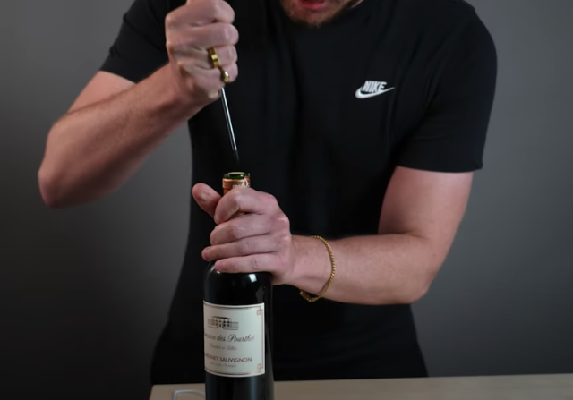 How do you open a bottle of wine with no corkscrew? Using a screwdriver to push cork down