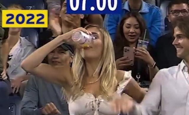 tennis fan chugs beer at the US Open