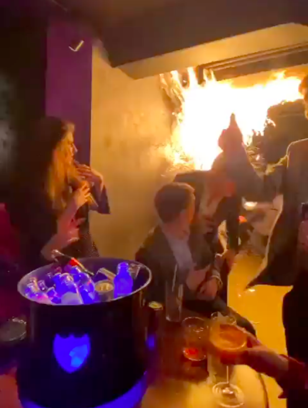 Diners flee as Christmas tree catches fire at London restaurant