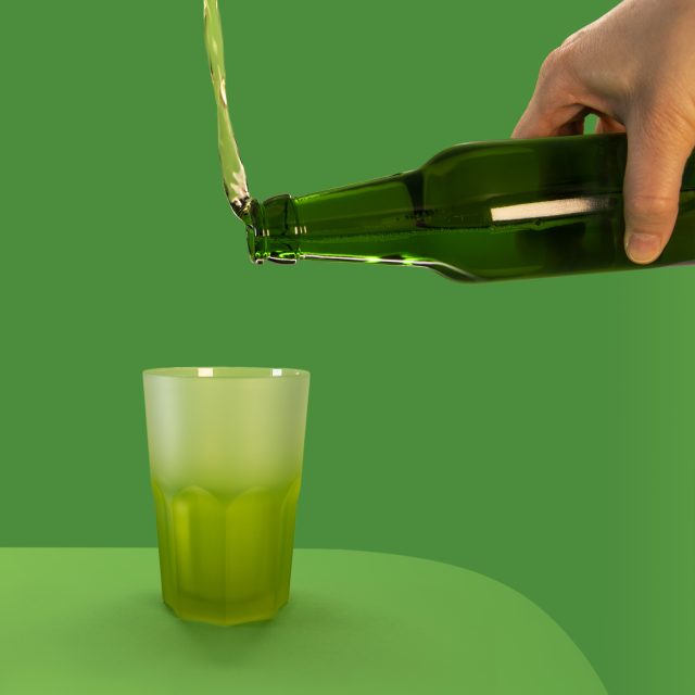 This photo shows a green beer bottle trying to pour beer into a green glass, only the liquid flows upwards instead of into the beer glass below: Moderate drinking trend driven by economic concerns not health consciousness