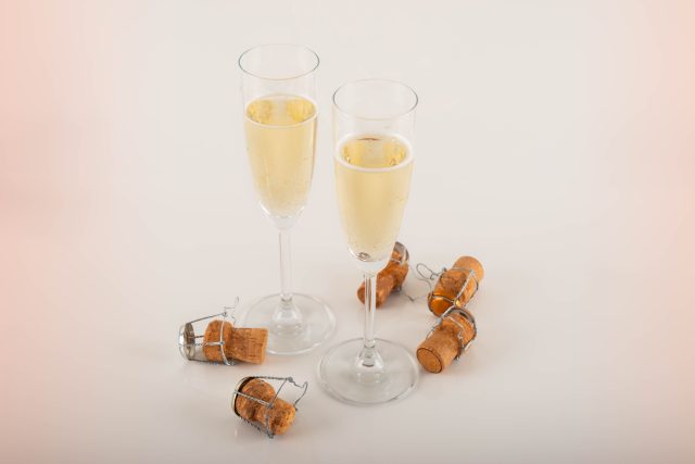 Glasses of Cava surrounded by corks: Majestic expects to sell one bottle of Cava per minute this Christmas