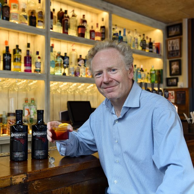 Image of Guy Lawrence drinking gin at bar: Former Bacardi exec appointed chair of The Drinks Trust