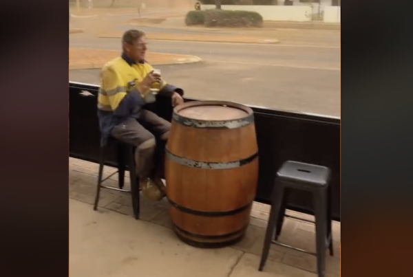 Australian man drinks beer calmly during storm