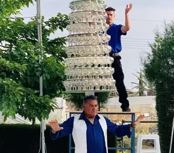 Cypriot man shatters wine glass balancing record