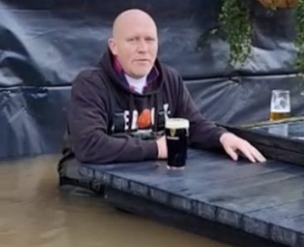 Publican drinks pint in waist-deep water