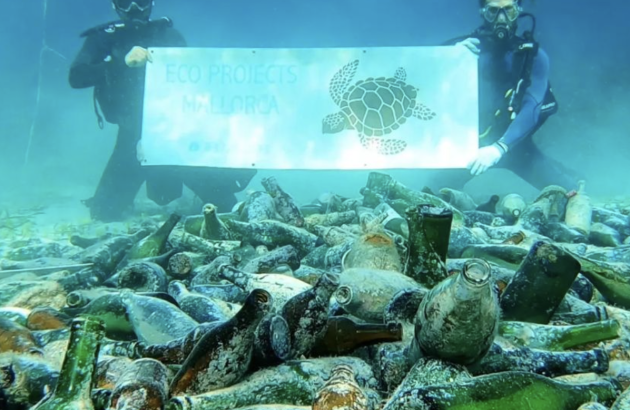 Divers remove discarded Champagne bottles from seabed