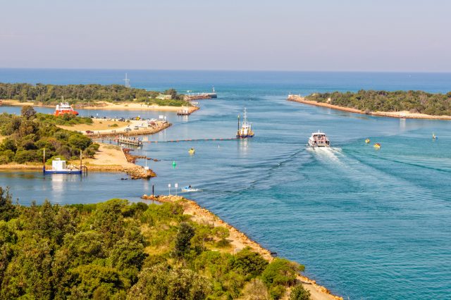 View of the Bullock and Rigby Islands and a man-made entrance into the Gippsland Lakes from the Lake Entrance Lookout - Lakes Entrance, Victoria, Australia