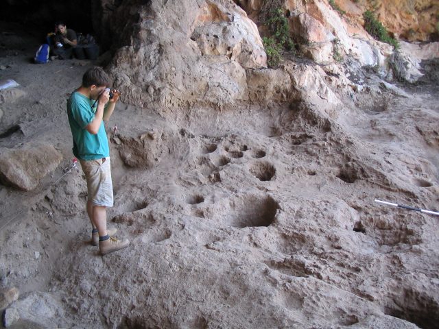 Rock mortars in Raqefet Cave, once used to prepare malt for beer manufacture. Credit: David Nadel.