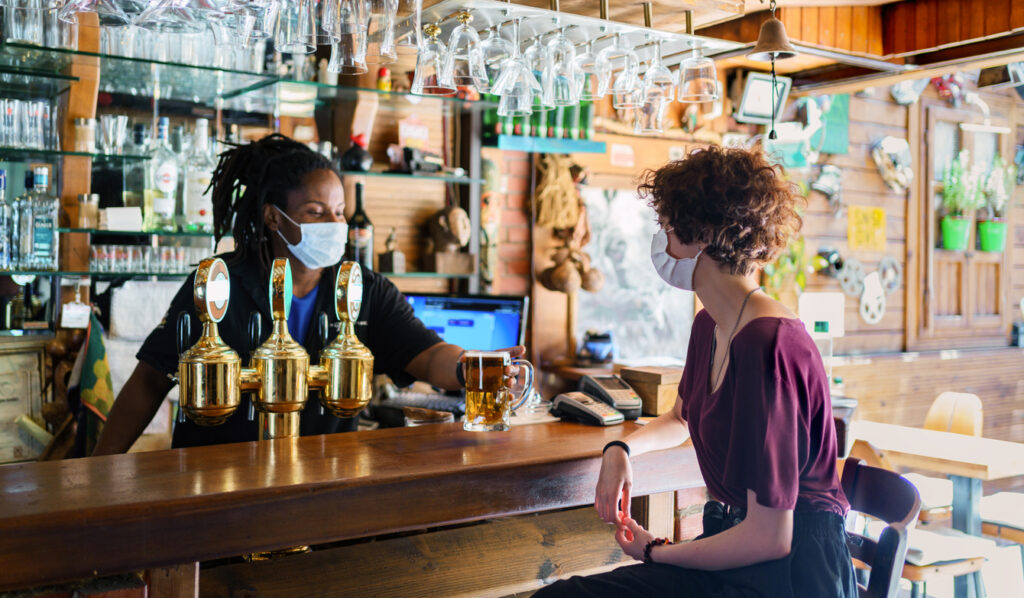 Vaccine passport: a beer being served in the pub